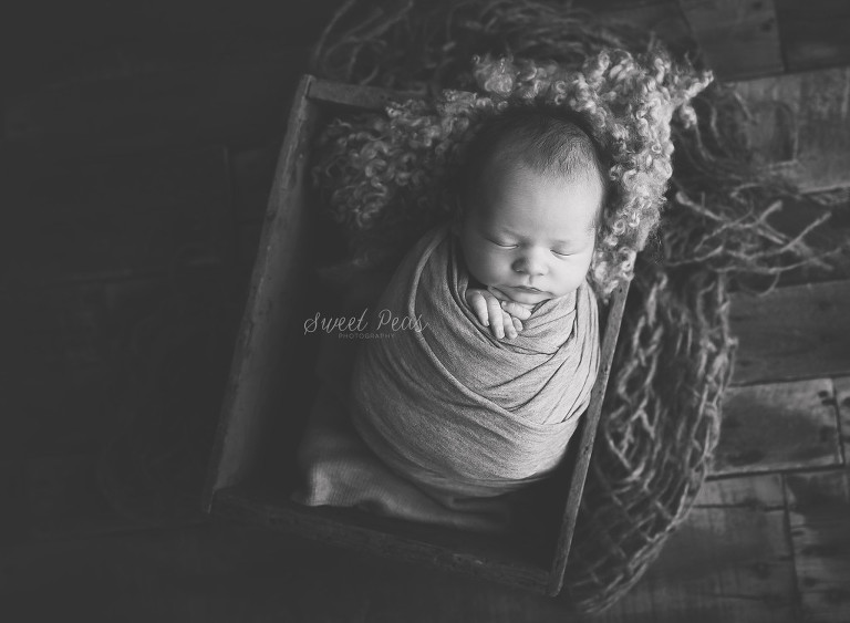 Kingman AZ Newborn Photographer baby in a wooden box