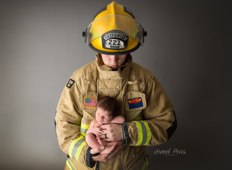 Kingman Newborn Photographer firefighter with newborn baby boy