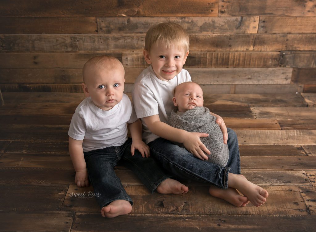 Kingman Family Photographer siblings and newborn