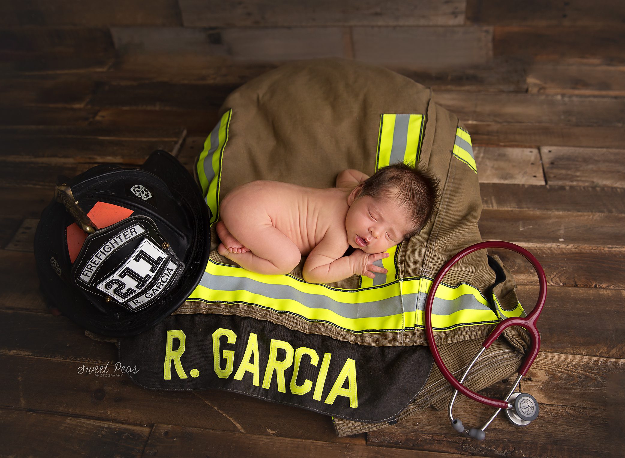 Kingman Newborn Photographer firefighter doctor props